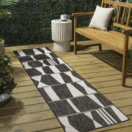 8' Black And Cream Geometric Indoor Outdoor Runner Rug Photo 5