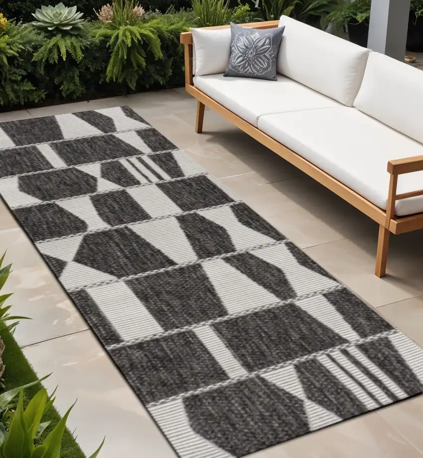 8' Black And Cream Geometric Indoor Outdoor Runner Rug Photo 1