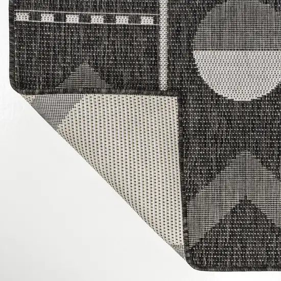 8' Black And Cream Geometric Indoor Outdoor Runner Rug Photo 1