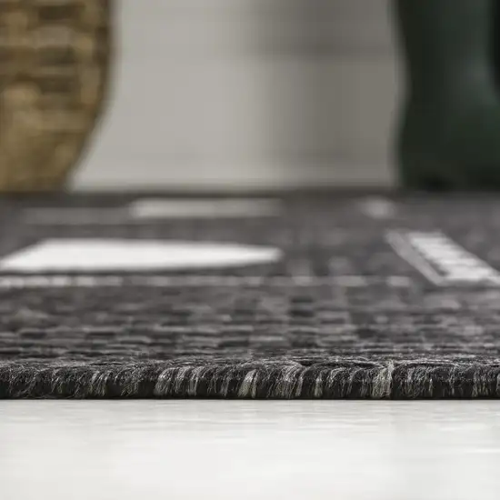 8' Black And Cream Geometric Indoor Outdoor Runner Rug Photo 6