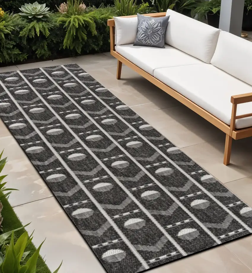 8' Black And Cream Geometric Indoor Outdoor Runner Rug Photo 1