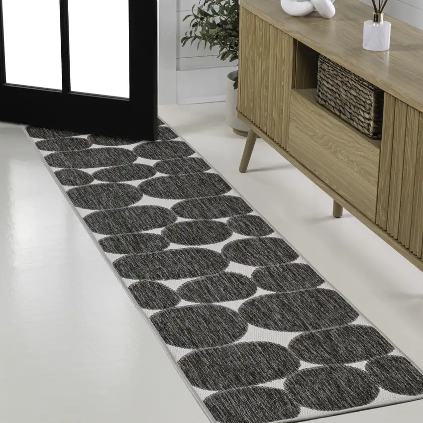 8' Black And Cream Geometric Indoor Outdoor Runner Rug Photo 4