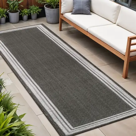 8' Black And Cream Indoor Outdoor Runner Rug Photo 1