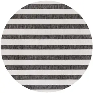 Photo of 8' Black And Cream Round Striped Indoor Outdoor Area Rug