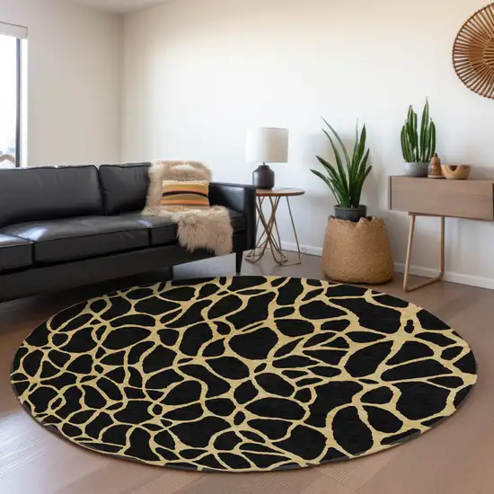8' Black And Gold Geometric Washable Round Rug With UV Protection Photo 4