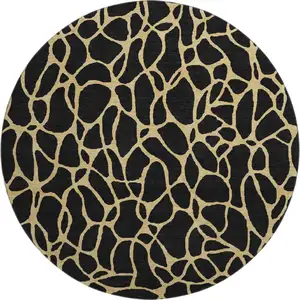 Photo of 8' Black And Gold Geometric Washable Round Rug With UV Protection