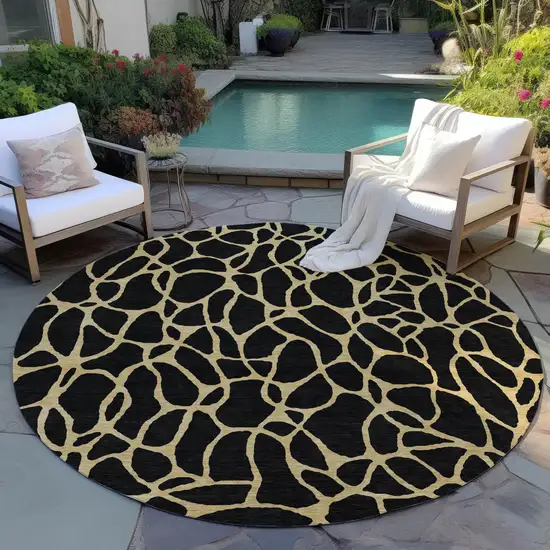 8' Black And Gold Round Geometric Washable Indoor Outdoor Area Rug Photo 6