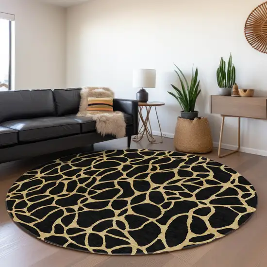 8' Black And Gold Round Geometric Washable Indoor Outdoor Area Rug Photo 7