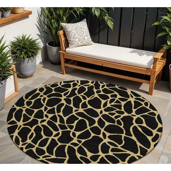 8' Black And Gold Round Geometric Washable Indoor Outdoor Area Rug Photo 1