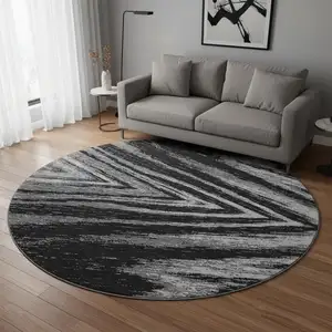 Photo of 8' Black And Gray Abstract Washable Round Rug With UV Protection