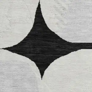 Photo of 8' Black And Ivory Abstract Geometric Washable Round Rug With UV Protection