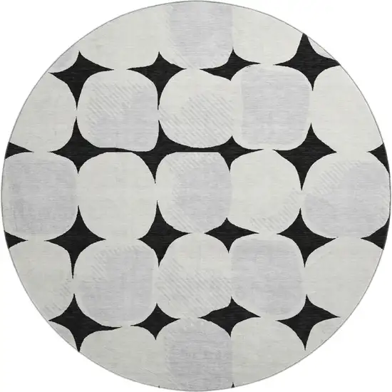 8' Black And Ivory Abstract Geometric Washable Round Rug With UV Protection Photo 1