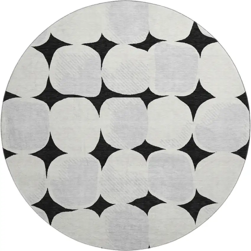 8' Black And Ivory Abstract Geometric Washable Round Rug With UV Protection Photo 1