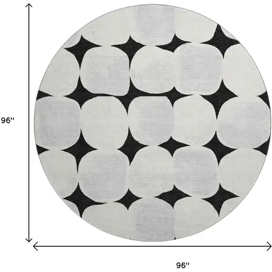 8' Black And Ivory Abstract Geometric Washable Round Rug With UV Protection Photo 8