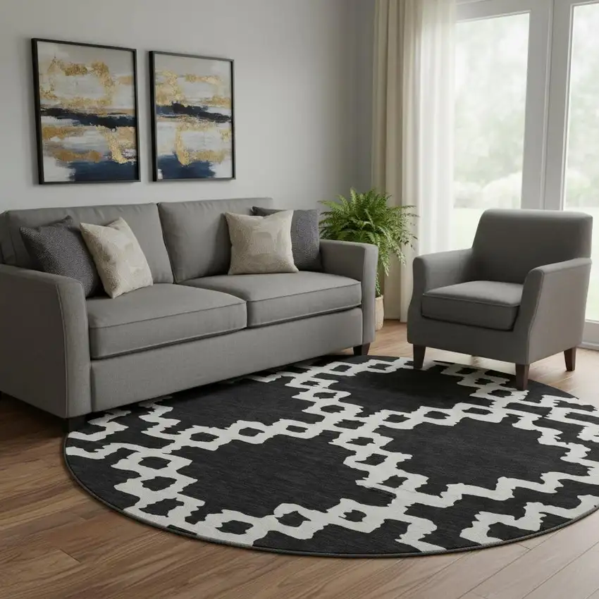 8' Black And Ivory Abstract Geometric Washable Round Rug With UV Protection Photo 1