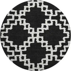 Photo of 8' Black And Ivory Abstract Geometric Washable Round Rug With UV Protection