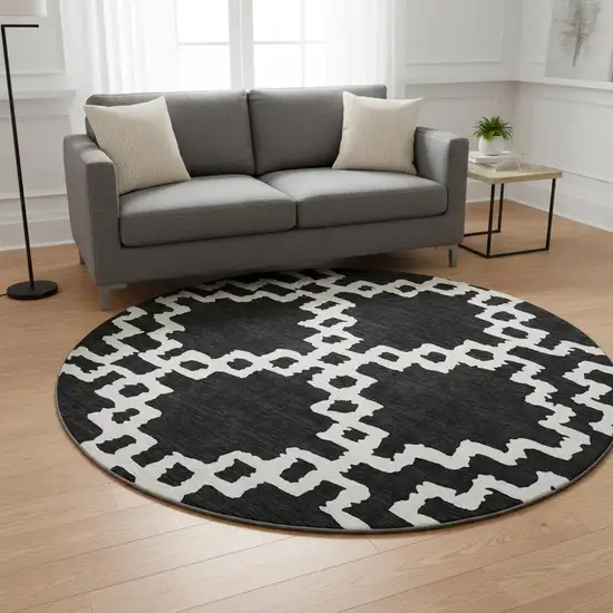8' Black And Ivory Abstract Geometric Washable Round Rug With UV Protection Photo 2