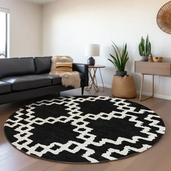 8' Black And Ivory Abstract Geometric Washable Round Rug With UV Protection Photo 5