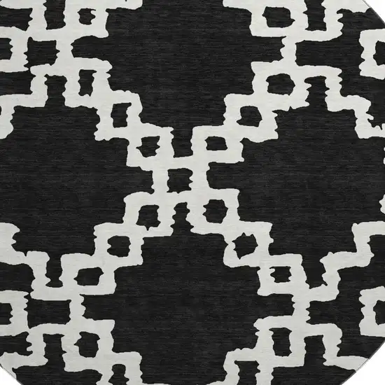 8' Black And Ivory Abstract Geometric Washable Round Rug With UV Protection Photo 3