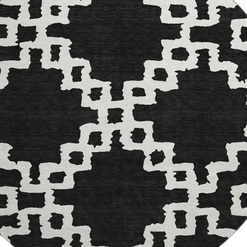 8' Black And Ivory Abstract Geometric Washable Round Rug With UV Protection Photo 3