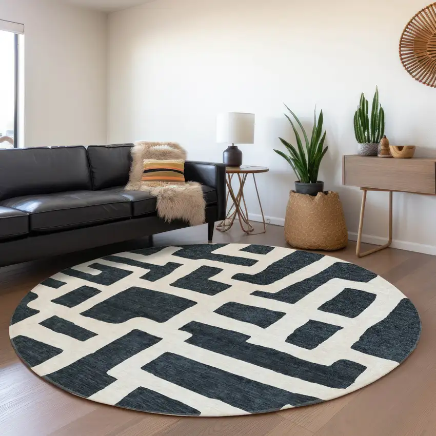 8' Black And Ivory Abstract Geometric Washable Round Rug With UV Protection Photo 4
