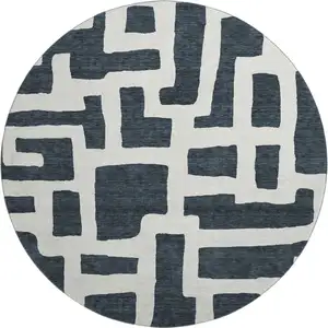 Photo of 8' Black And Ivory Abstract Geometric Washable Round Rug With UV Protection