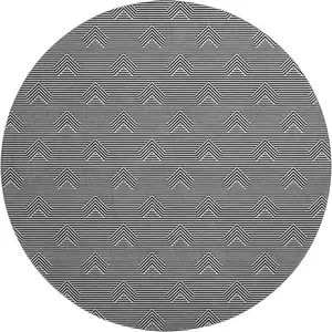 Photo of 8' Black And Ivory Abstract Geometric Washable Round Rug With UV Protection