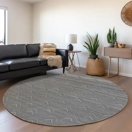 8' Black And Ivory Abstract Geometric Washable Round Rug With UV Protection Photo 5