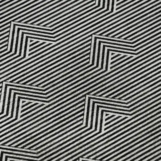 8' Black And Ivory Abstract Geometric Washable Round Rug With UV Protection Photo 9