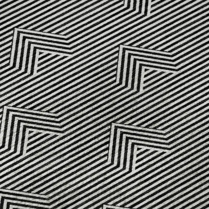 8' Black And Ivory Abstract Geometric Washable Round Rug With UV Protection Photo 9