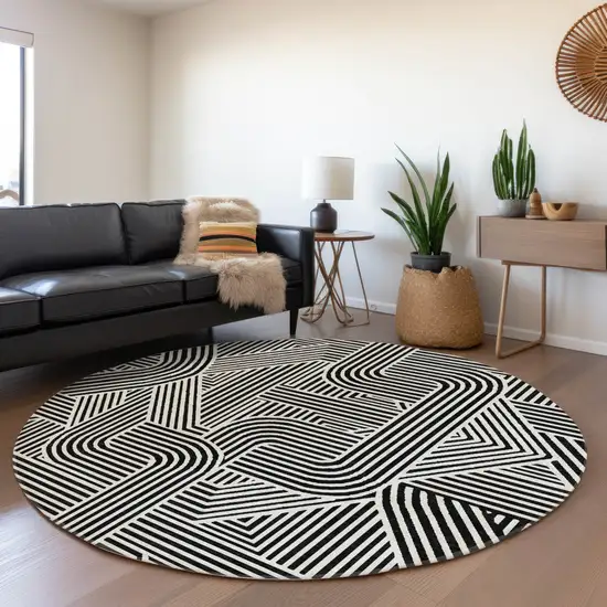 8' Black And Ivory Abstract Geometric Washable Round Rug With UV Protection Photo 5