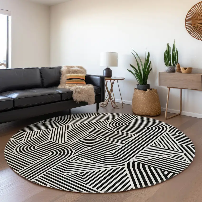 8' Black And Ivory Abstract Geometric Washable Round Rug With UV Protection Photo 5