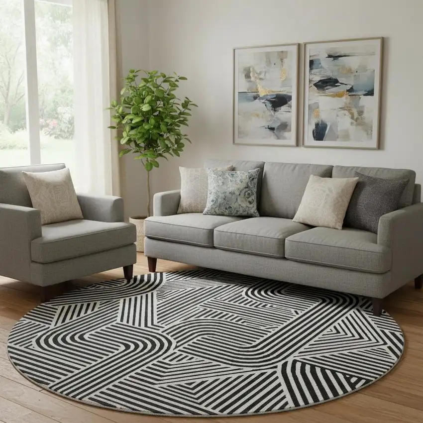 8' Black And Ivory Abstract Geometric Washable Round Rug With UV Protection Photo 1