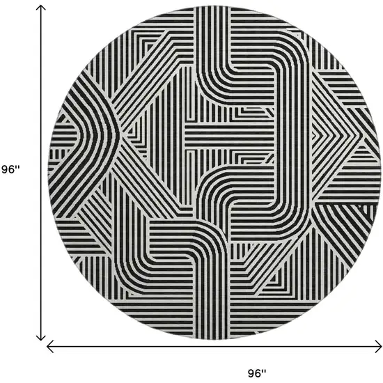 8' Black And Ivory Abstract Geometric Washable Round Rug With UV Protection Photo 3