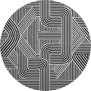 Photo of 8' Black And Ivory Abstract Geometric Washable Round Rug With UV Protection