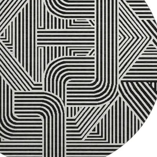 8' Black And Ivory Abstract Geometric Washable Round Rug With UV Protection Photo 3