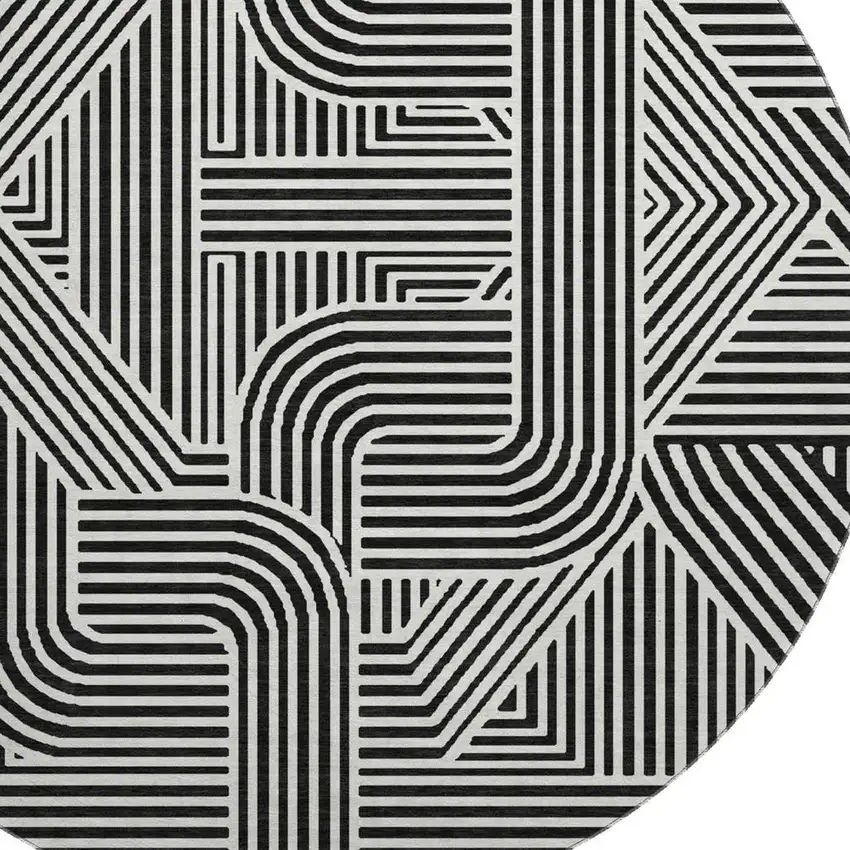 8' Black And Ivory Abstract Geometric Washable Round Rug With UV Protection Photo 3