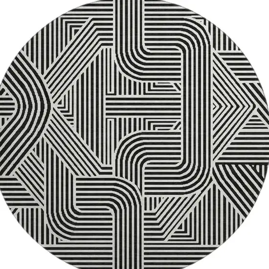 8' Black And Ivory Abstract Geometric Washable Round Rug With UV Protection Photo 4