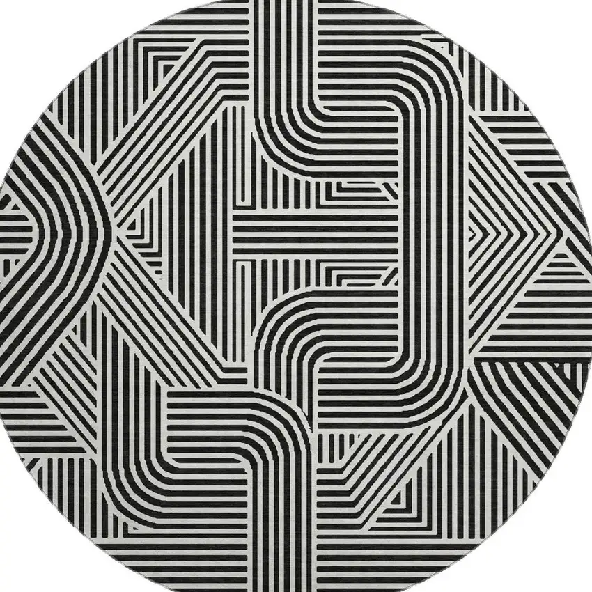 8' Black And Ivory Abstract Geometric Washable Round Rug With UV Protection Photo 4