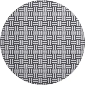Photo of 8' Black And Ivory Abstract Geometric Washable Round Rug With UV Protection
