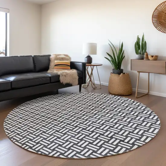 8' Black And Ivory Abstract Geometric Washable Round Rug With UV Protection Photo 4