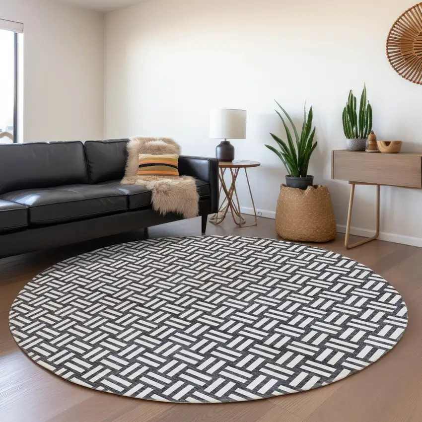 8' Black And Ivory Abstract Geometric Washable Round Rug With UV Protection Photo 4