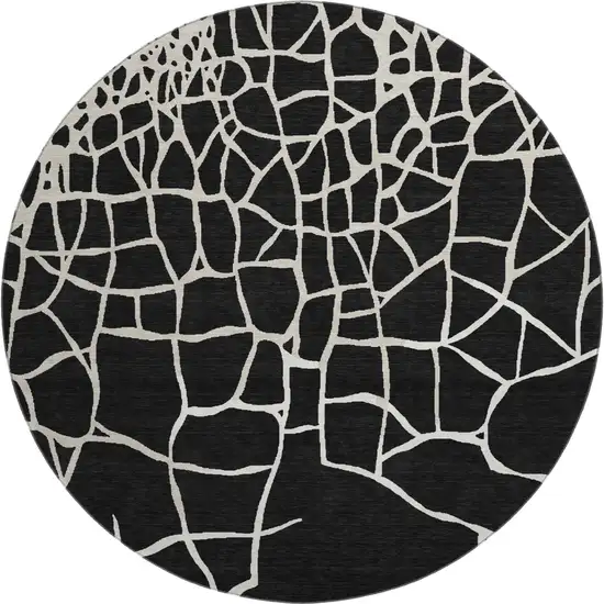 8' Black And Ivory Abstract Geometric Washable Round Rug With UV Protection Photo 1