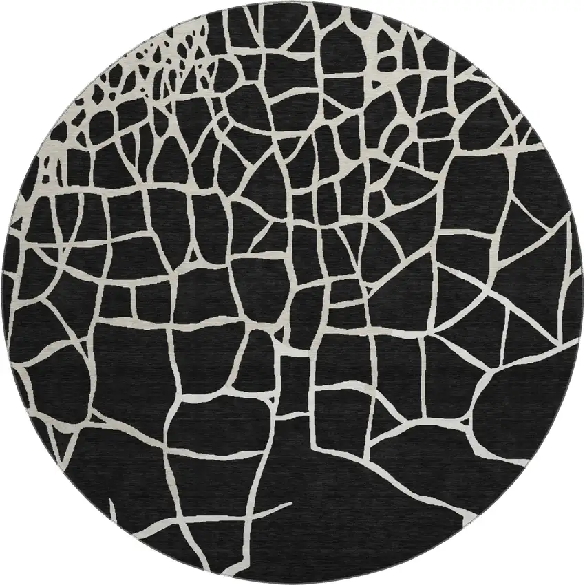 8' Black And Ivory Abstract Geometric Washable Round Rug With UV Protection Photo 1