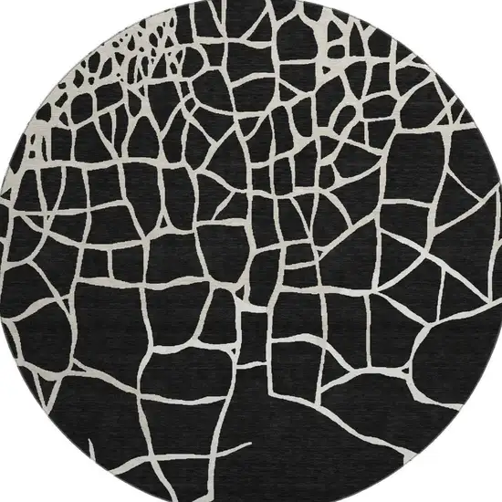 8' Black And Ivory Abstract Geometric Washable Round Rug With UV Protection Photo 2