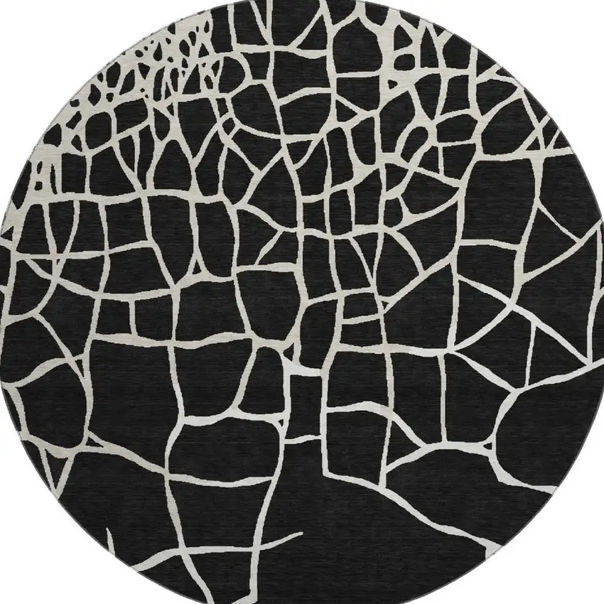 8' Black And Ivory Abstract Geometric Washable Round Rug With UV Protection Photo 2