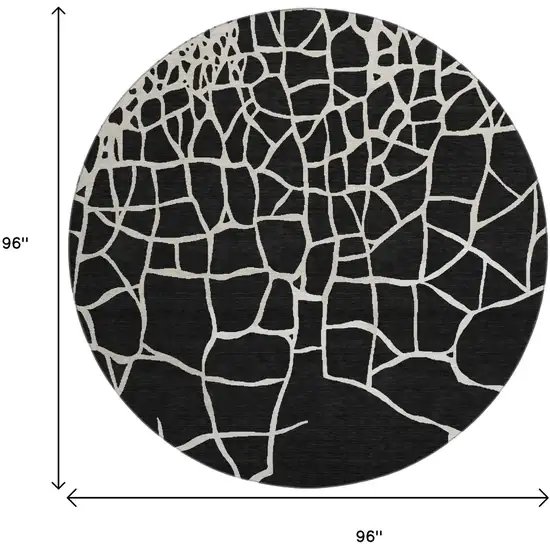8' Black And Ivory Abstract Geometric Washable Round Rug With UV Protection Photo 9