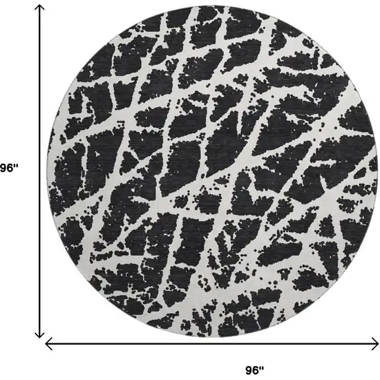 8' Black And Ivory Abstract Washable Round Rug With UV Protection Photo 3