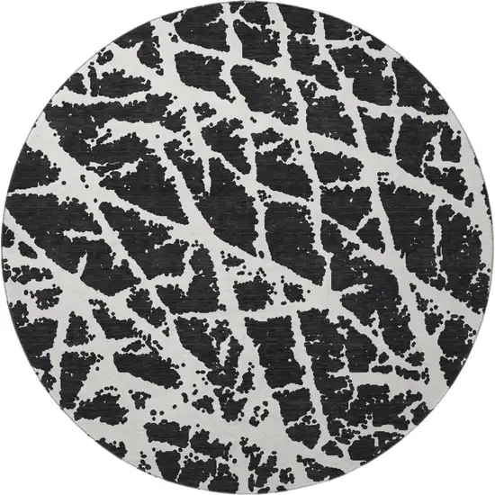 8' Black And Ivory Abstract Washable Round Rug With UV Protection Photo 4