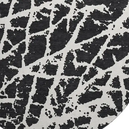 8' Black And Ivory Abstract Washable Round Rug With UV Protection Photo 3